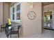 Welcoming entrance showcasing the condo's exterior with seating and a decorative wall hanging at 5250 Hyland Hills Ave # 1514, Sarasota, FL 34241