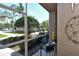 Relaxing screened lanai offering peaceful views of lush landscaping at 5250 Hyland Hills Ave # 1514, Sarasota, FL 34241