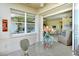 Lanai featuring an outdoor dining set and scenic views of the property at 5250 Hyland Hills Ave # 1514, Sarasota, FL 34241