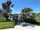 Natural Preserve Observation Deck on the water with lush greenery and an alligator warning sign at 5250 Hyland Hills Ave # 1514, Sarasota, FL 34241