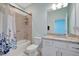Bathroom featuring shower-tub combination with tiled walls, granite countertop, and white cabinets at 5317 Coral Reef Way, Bradenton, FL 34211