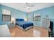 Inviting bedroom with a comfortable bed, modern furnishings, and wood floors at 5317 Coral Reef Way, Bradenton, FL 34211