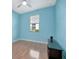 Cozy bedroom featuring wood floors, a modern ceiling fan and a window with a view at 5317 Coral Reef Way, Bradenton, FL 34211