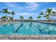 Community pool with lane lines and plenty of lounge chairs for relaxing in the Florida sunshine at 5317 Coral Reef Way, Bradenton, FL 34211