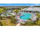 An aerial view of the neighborhood community pool, tennis courts, and playground at 5317 Coral Reef Way, Bradenton, FL 34211