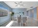 Bright dining area features tile floors, a modern light fixture and seating for six at 5317 Coral Reef Way, Bradenton, FL 34211