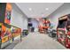 Spacious game room with pinball and arcade games provides entertainment for residents and guests at 5317 Coral Reef Way, Bradenton, FL 34211