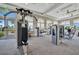 State-of-the-art gym offers various weight machines and exercise equipment with views of lush green landscape at 5317 Coral Reef Way, Bradenton, FL 34211