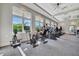 Modern gym equipped with cardio machines and expansive windows offering outside views during your workout at 5317 Coral Reef Way, Bradenton, FL 34211
