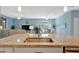 Open kitchen features stainless appliances, granite countertops, and tiled floors at 5317 Coral Reef Way, Bradenton, FL 34211