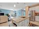 Open kitchen features granite countertops, stainless appliances, and tiled floors at 5317 Coral Reef Way, Bradenton, FL 34211
