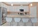 Spacious island kitchen featuring a large island with bar seating and stainless steel appliances at 5317 Coral Reef Way, Bradenton, FL 34211