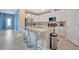 Bright kitchen featuring a large island with bar seating and stainless steel appliances at 5317 Coral Reef Way, Bradenton, FL 34211