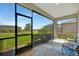 Enjoy this covered lanai with extended views of the water and beautiful backyard with ample seating at 5317 Coral Reef Way, Bradenton, FL 34211