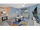 Living Room with adjacent Kitchen and Dining Room, and white leather sofas at 5317 Coral Reef Way, Bradenton, FL 34211