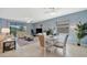 Spacious living room boasts tile floors, a large window, comfortable seating and adjacent dining area at 5317 Coral Reef Way, Bradenton, FL 34211