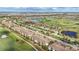 Aerial view of golf community with many houses situated along the golf course and ponds at 5517 Palmer Cir # 203, Bradenton, FL 34211