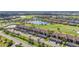 Beautiful aerial view of condos overlooking a lush green golf course and shimmering lakes at 5517 Palmer Cir # 203, Bradenton, FL 34211