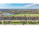 Aerial view of community featuring pond, golf course, and residences at 5517 Palmer Cir # 203, Bradenton, FL 34211
