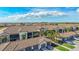 Aerial view of community with many homes, garages, and gorgeous landscaping at 5517 Palmer Cir # 203, Bradenton, FL 34211