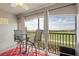 Balcony with comfortable seating and a view of the golf course at 5517 Palmer Cir # 203, Bradenton, FL 34211