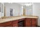 Bathroom featuring double sinks and granite countertops at 5517 Palmer Cir # 203, Bradenton, FL 34211