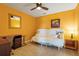 Cozy bedroom with futon, ceiling fan, and desk at 5517 Palmer Cir # 203, Bradenton, FL 34211