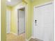 Foyer with front door, interior doors, tile flooring, and neutral paint at 5517 Palmer Cir # 203, Bradenton, FL 34211