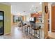 Modern kitchen featuring stainless appliances, dark wood cabinetry, and granite countertops at 5517 Palmer Cir # 203, Bradenton, FL 34211