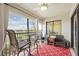 Relaxing lanai features comfortable seating and scenic views of the golf course at 5517 Palmer Cir # 203, Bradenton, FL 34211