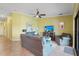 Comfortable living room features neutral tones, a ceiling fan, and plenty of natural light at 5517 Palmer Cir # 203, Bradenton, FL 34211