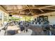Expansive outdoor bar and dining area with ample seating and a stylish, covered space at 5517 Palmer Cir # 203, Bradenton, FL 34211