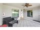 Covered outdoor porch with furniture and ceiling fan at 5517 Palmer Cir # 203, Bradenton, FL 34211