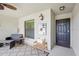 Outdoor porch with furniture, ceiling fan, and front door at 5517 Palmer Cir # 203, Bradenton, FL 34211