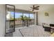 Spacious screened lanai with comfortable seating and a ceiling fan for relaxed outdoor living at 5517 Palmer Cir # 203, Bradenton, FL 34211