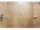 Neutral tile shower with chrome shower head and faucet fixtures at 5517 Palmer Cir # 203, Bradenton, FL 34211