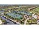 Overhead view of the community's numerous tennis courts with lush tropical landscaping and nearby parking at 5517 Palmer Cir # 203, Bradenton, FL 34211