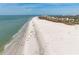 Beautiful wide sandy beach along the gulf coast with clear blue water at 5740 Midnight Pass Rd # 402, Sarasota, FL 34242