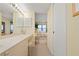 Bathroom featuring vanity area and a glimpse into the bedroom with ocean views at 5740 Midnight Pass Rd # 402, Sarasota, FL 34242