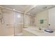 Bright bathroom features a shower with glass doors and accessible features at 5740 Midnight Pass Rd # 402, Sarasota, FL 34242