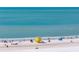 Beautiful gulf coast white sand beach on a sunny day with a lifeguard station at 5740 Midnight Pass Rd # 402, Sarasota, FL 34242