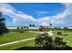 Beautiful landscaped lawn and path leading directly to the white sand beach at 5740 Midnight Pass Rd # 402, Sarasota, FL 34242
