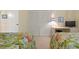 Bedroom featuring two beds, a work desk, and closet with plenty of storage at 5740 Midnight Pass Rd # 402, Sarasota, FL 34242