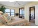 Bedroom featuring sliding glass doors to a private balcony and calming ocean views at 5740 Midnight Pass Rd # 402, Sarasota, FL 34242
