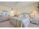 Serene bedroom featuring ocean views, a dresser, and a soothing color palette at 5740 Midnight Pass Rd # 402, Sarasota, FL 34242