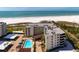 Beachfront condo complex featuring a pool, covered parking, and easy access to the beautiful white sands at 5740 Midnight Pass Rd # 402, Sarasota, FL 34242
