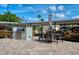 Grilling and outdoor dining area with a built-in grill and covered seating at 5740 Midnight Pass Rd # 402, Sarasota, FL 34242