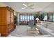 Bright living room with sliding glass doors to outdoor balcony with gulf views at 5740 Midnight Pass Rd # 402, Sarasota, FL 34242