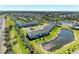 An aerial view showing the buildings, ponds, and landscaping at 5778 Windy Bay Ter, Nokomis, FL 34275