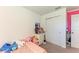 Inviting bedroom with neutral carpet, double closet, and a cozy feel at 5778 Windy Bay Ter, Nokomis, FL 34275